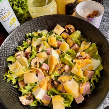 Parisian salad with ham, Emmental, hard-boiled eggs, dry-fried mushrooms and mustard vinaigrette