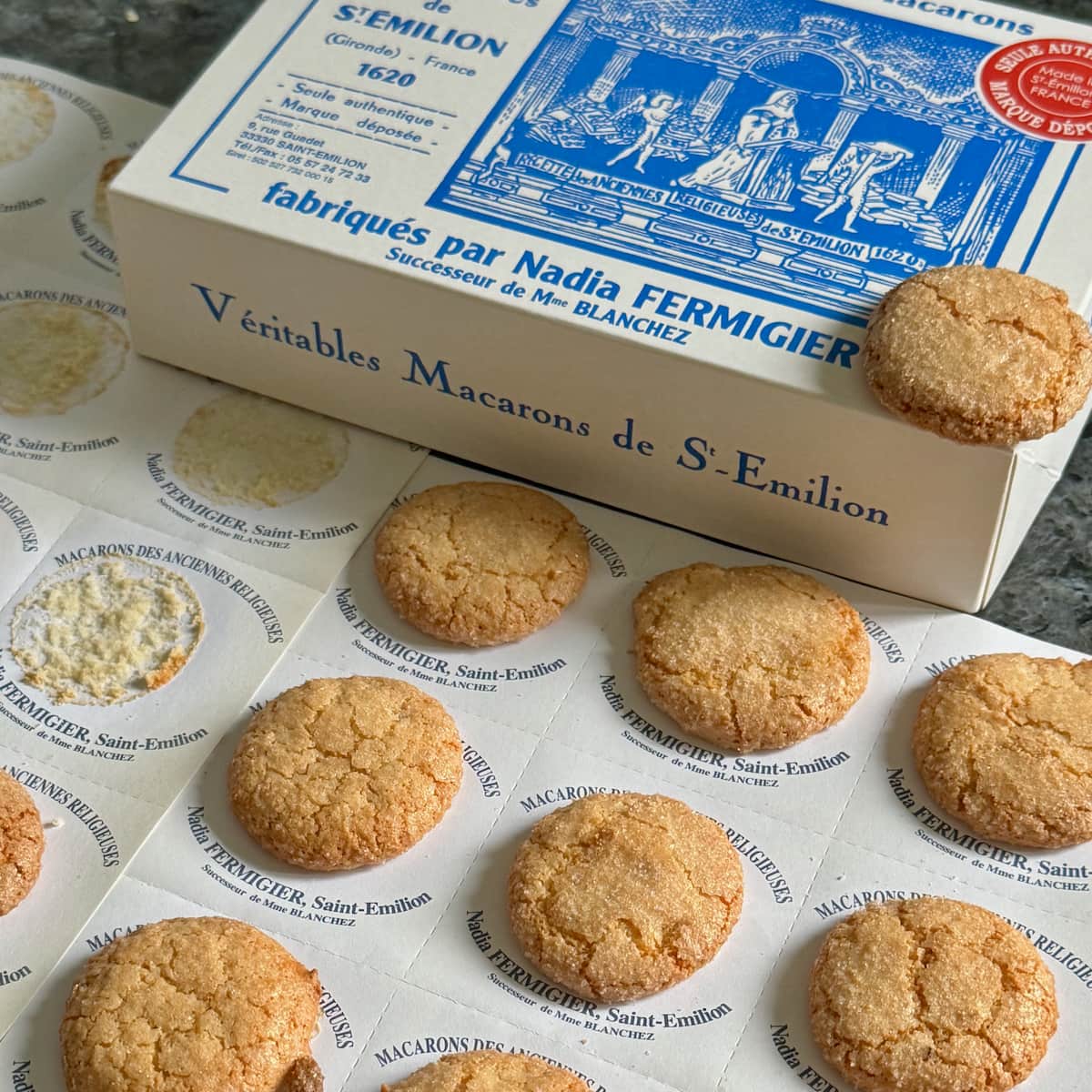 Thin, rustic French macarons traditionally made in St Emilion showing a rougher texture than the smooth Parisian macaron