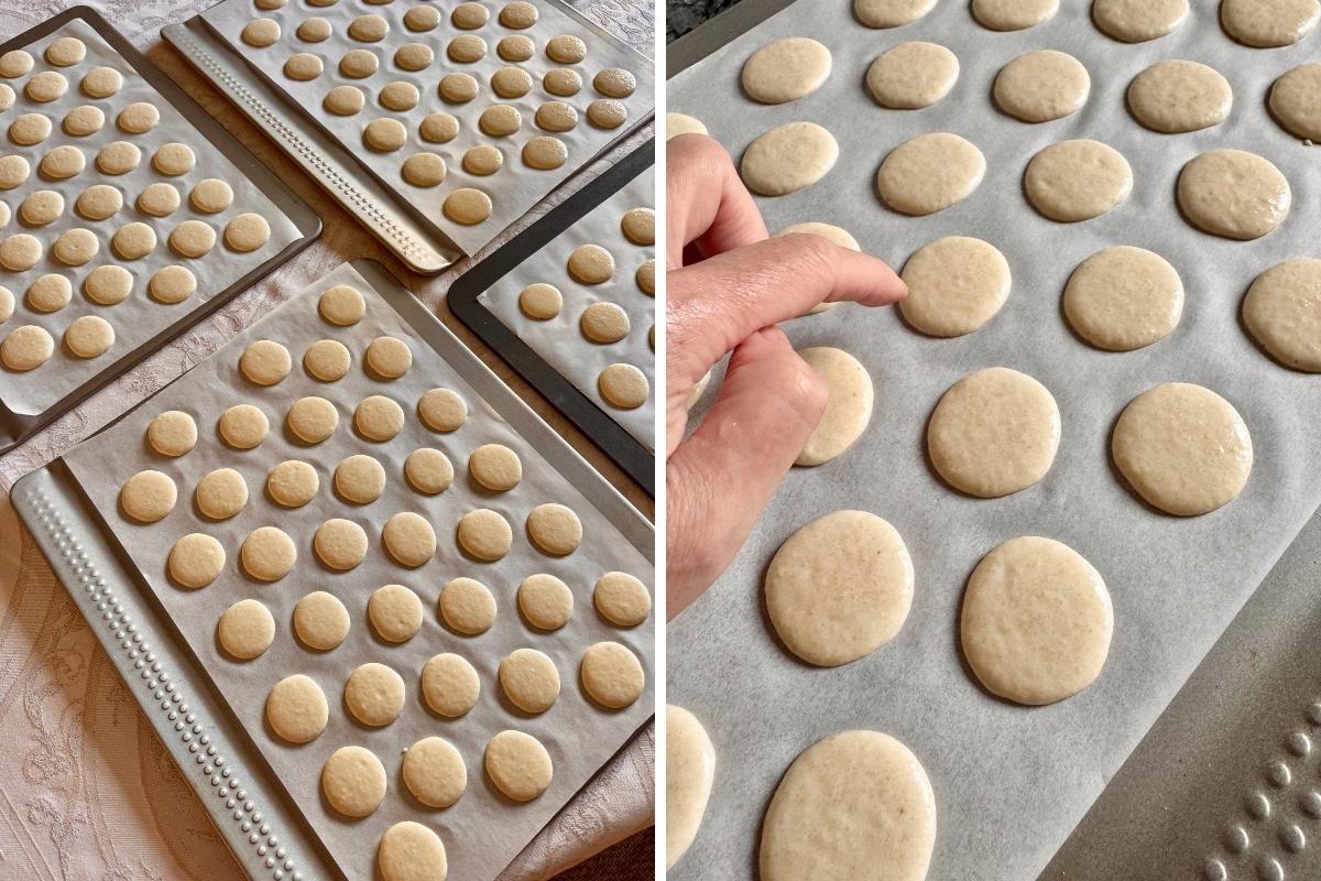 Trays of macaron shells resting to air and form a dull skin before baking